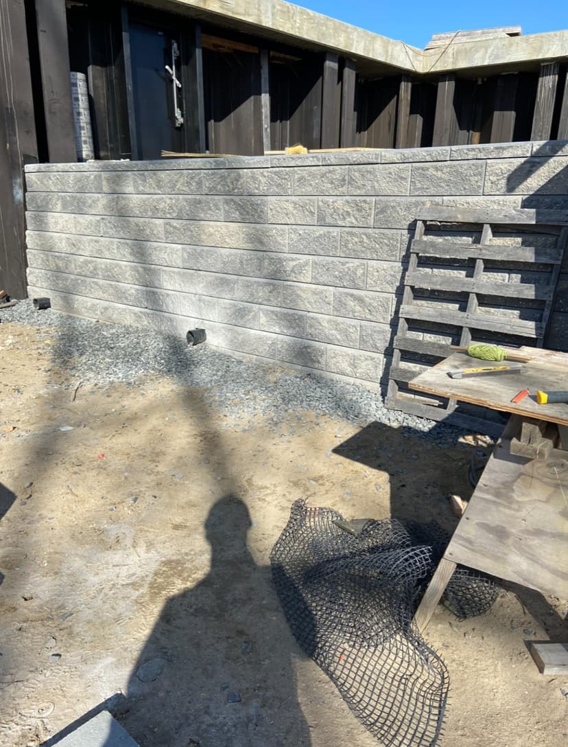 Retaining wall construction and repair